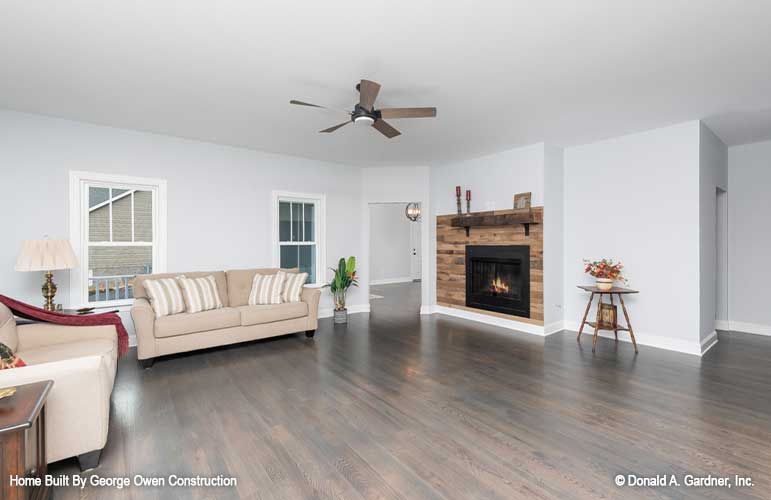 Fireplace and ceiling fan in the great room. The Ireland plan 346.