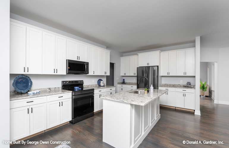 All white cabinets in the kitchen. The Ireland plan 346.