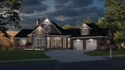 This is an illustration of the front of house plan 1331 The Ironwood at dusk