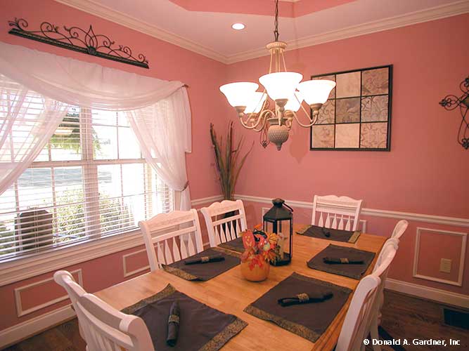 This is a photograph of the dining room of farmhouse house plan 1075 The Ives as built by a customer