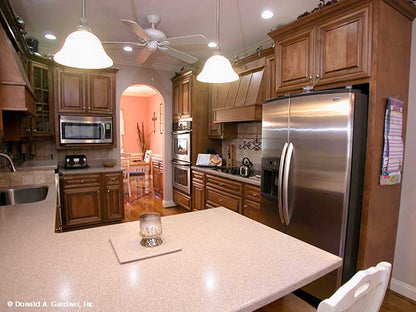 This is a photograph of the kitchen of farmhouse house plan 1075 The Ives as built by a customer