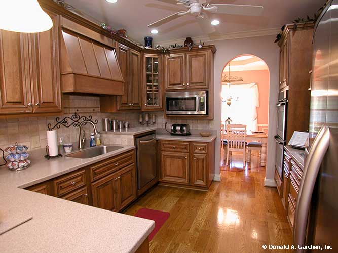 This is a photograph of the kitchen space of farmhouse house plan 1075 The Ives as built by a customer