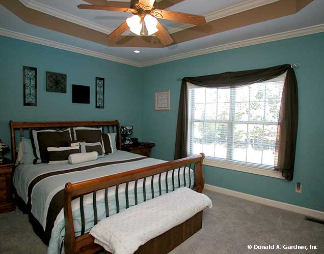 This is a photograph of the master bedroom of farmhouse house plan 1075 The Ives as built by a customer