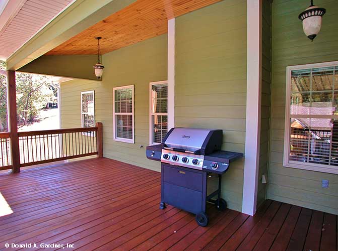 This is a photograph of the rear porch of farmhouse house plan 1075 The Ives as built by a customer