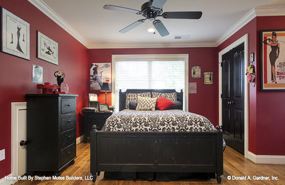 Secondary bedroom with crown molding along the ceiling and double windows. The Ivy Creek plan 921