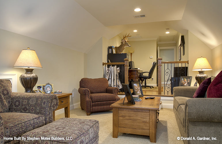 Second view of the bonus room with step up into office area separated by railings. The Ivy Creek plan 921