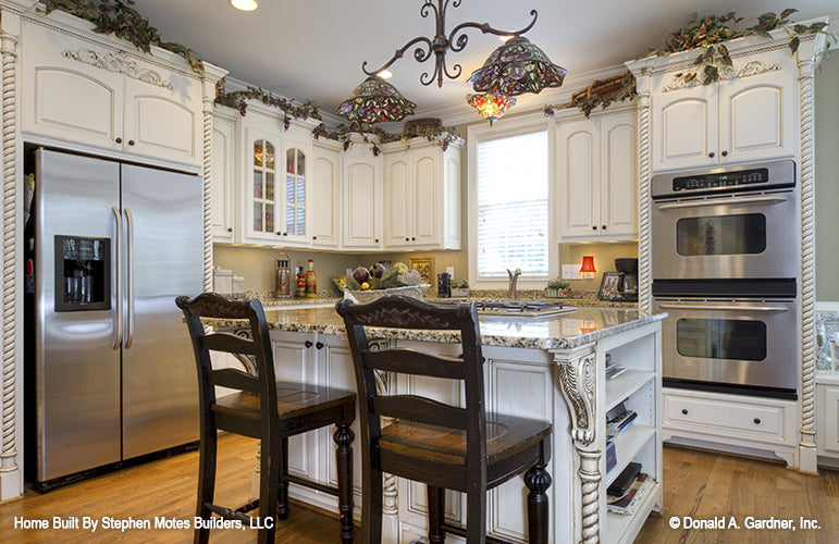 Beautiful kitchen with island seating space. The Ivy Creek plan 921