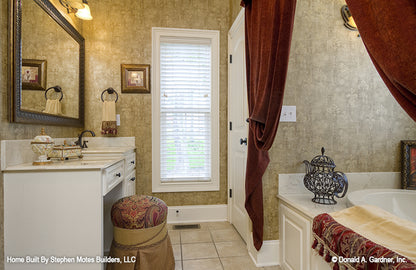 Vanity with seating space in master bathroom with the bathroom across. The Ivy Creek plan 921