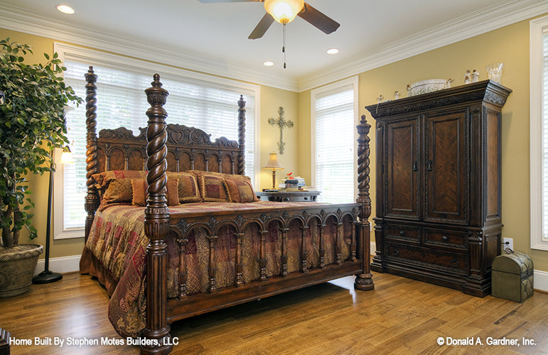 Master bedroom with crown molding flat ceiling. The Ivy Creek plan 921