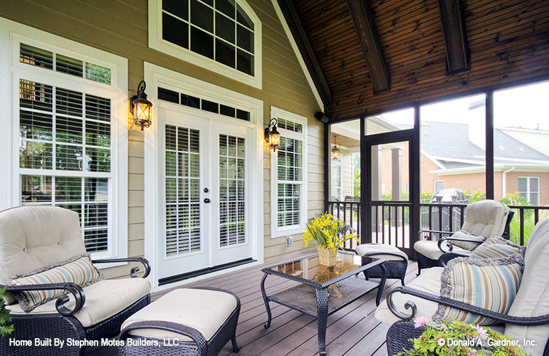 Vaulted ceiling in screen porch with stained wood and beams on the ceiling. The Ivy Creek plan 921