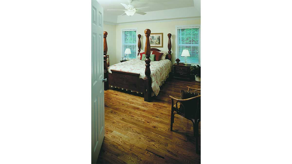 This is a photograph of the master bedroom of three bedroom house plan 432 The Jacksonboro as built by a customer