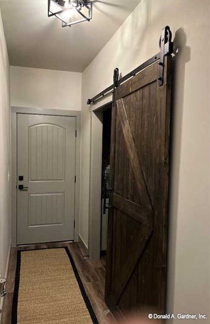 Hallway with sliding barndoor. Janet plan 1513