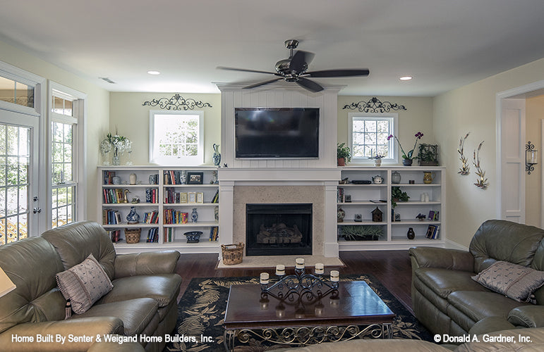 Great room view of the fireplace with built in bookshelves. The Jarrell plan 1017.