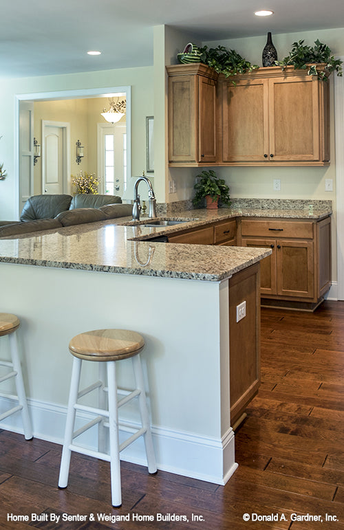 Counter height bar seating in the kitchen. The Jarrell plan 1017.