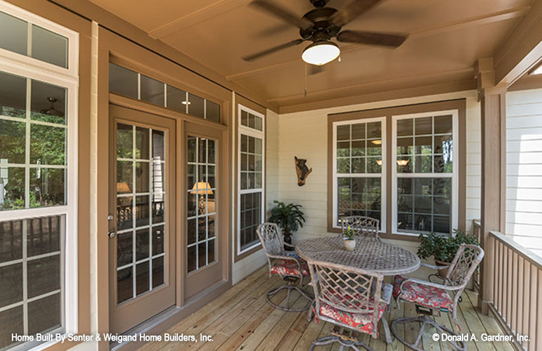 Covered rear porch with ceiling fan. The Jarrell plan 1017.