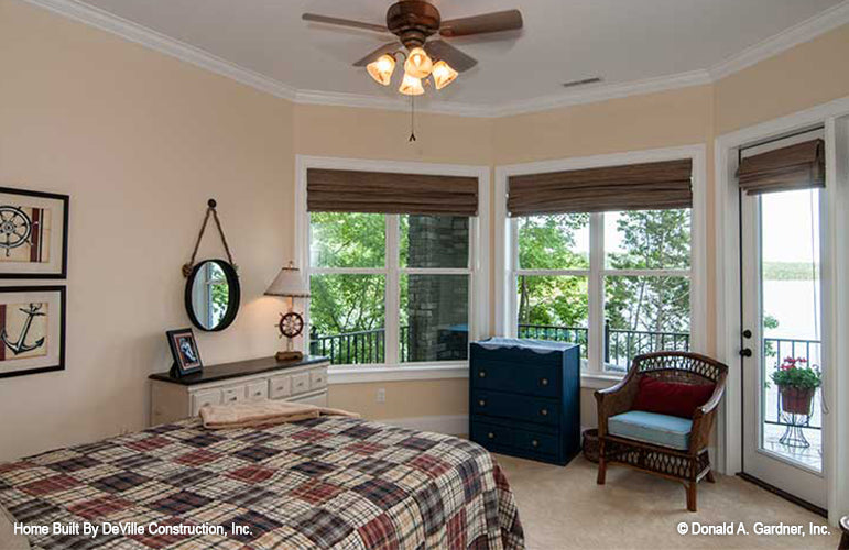 Flat ceiling in bedroom with exterior door access to the patio. The Jasper Hill plan 5020.