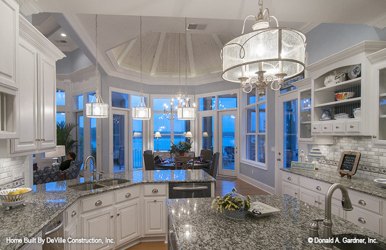 White cabinets in the kitchen. The Jasper Hill plan 5020.