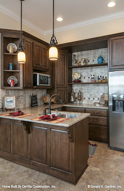 Dark wood cabinets in the kitchenette. The Jasper Hill plan 5020.