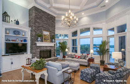 Floor to ceiling arched window in the living room. The Jasper Hill plan 5020.