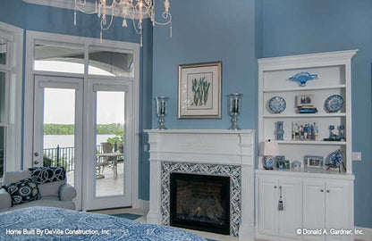 White mantel and built in shelves in the master bedroom. The Jasper Hill plan 5020.