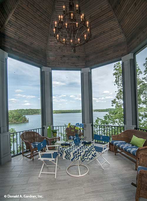 Wood-stained ceiling and chandelier on the rear porch. The Jasper Hill plan 5020.