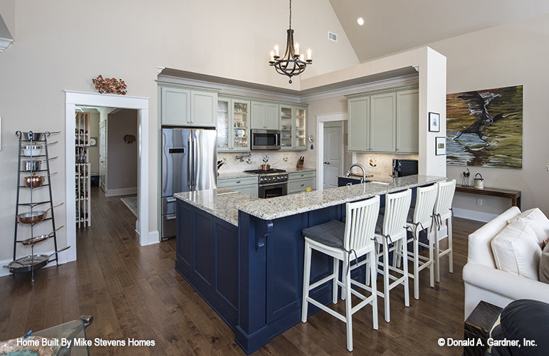 This is a photograph of the kitchen island of three bedroom house plan 1185 The Jenner as built by a customer