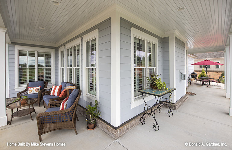 This is a photograph of the rear porch of three bedroom house plan 1185 The Jenner as built by a customer