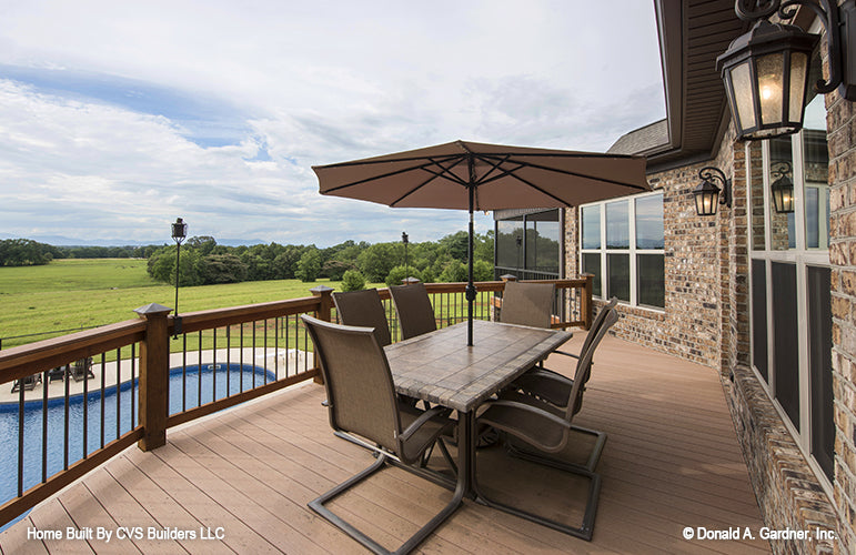 Rear deck picture with pool view of luxury house plan 1033 The Jerivale