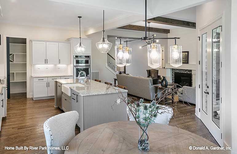 Picture of kitchen island and dining nook as designed by customer for plan 1464 The Justine