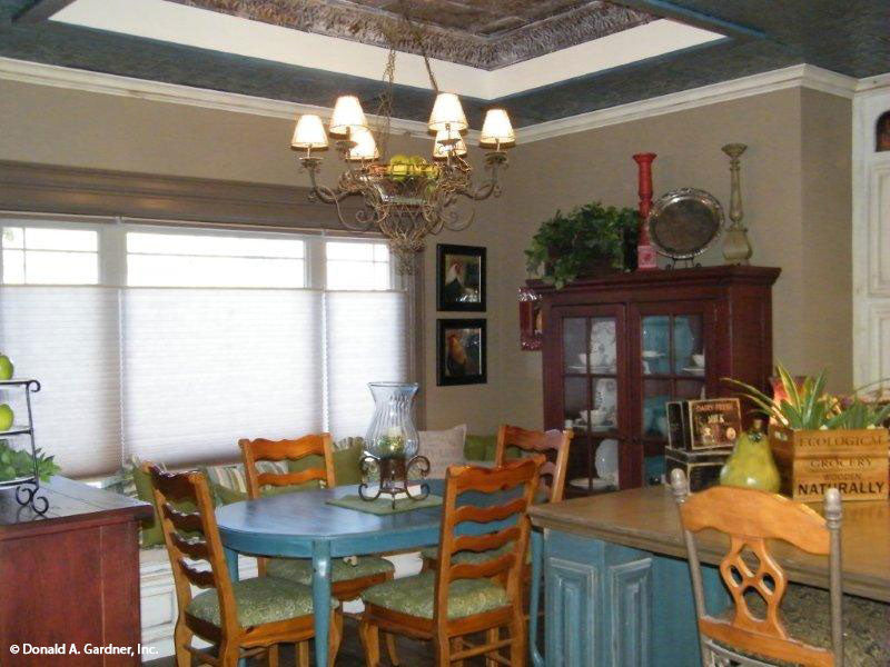 This is a dining room picture of the front of small house plan 1189 The Kellswater