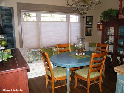 This is a dining room nook picture of the front of small house plan 1189 The Kellswater