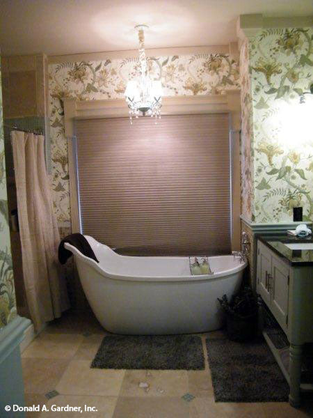 This is a master bathroom with tub picture of the front of small house plan 1189 The Kellswater