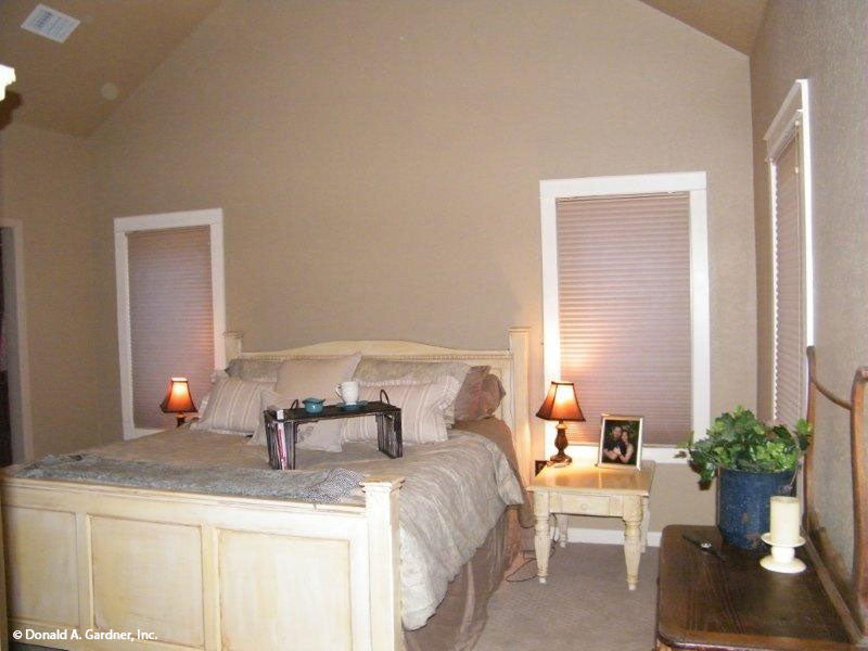 This is a master bedroom picture of the front of small house plan 1189 The Kellswater