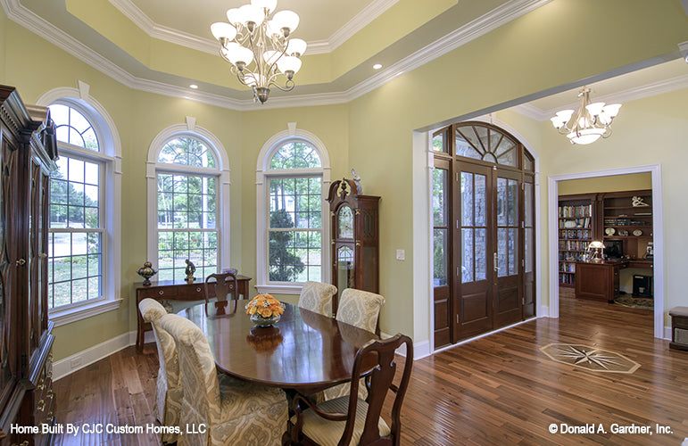 This is a picture of the dining room and front entrance of luxury house plan 1166 The Kenningstone