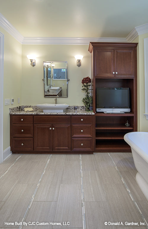 This is a master bath vanity and storage of luxury house plan 1166 The Kenningstone