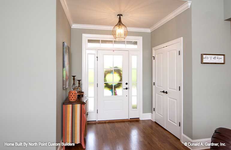 Crown molding around the ceiling in the foyer. The Landry plan 1291.