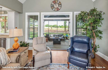 Great room view of the doors to the screened porch open. The Landry plan 1291.