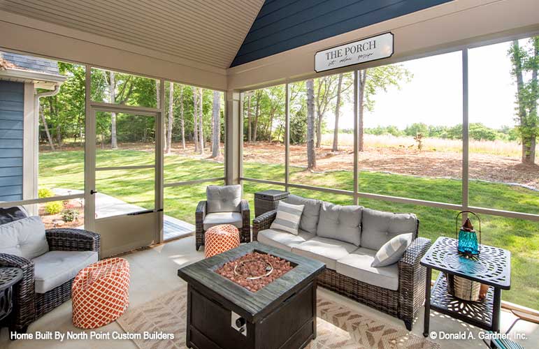 Seating and firepit in the screened in porch. The Landry plan 1291.