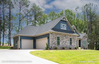 Side garage view photograph submitted by the customer. The Landry plan 1291.