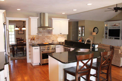 White cabinets in the kitchen. The Larson plan 1629.