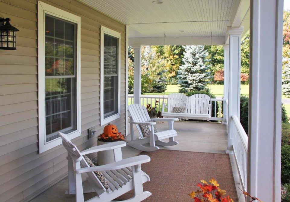 Rocking chairs on the covered porch. The Larson plan 1629.