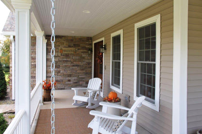 White rails on the porch. The Larson plan 1629.