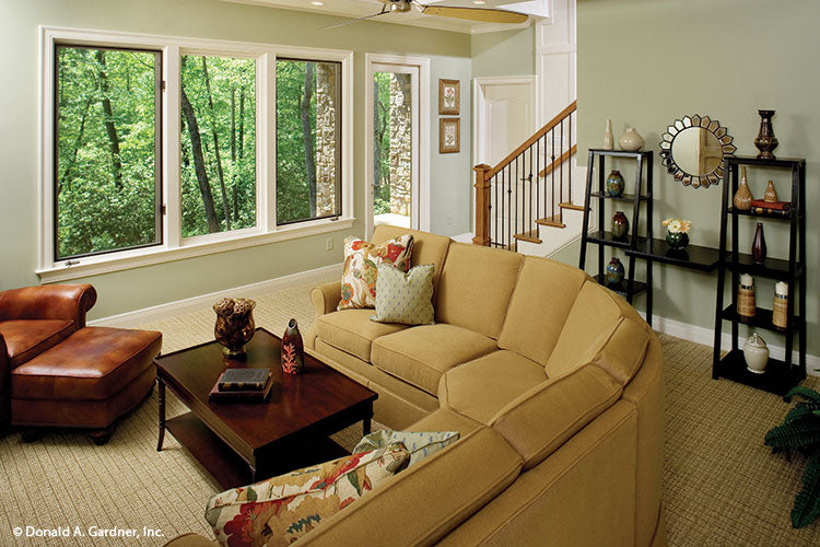 Large windows and exterior door in the entertainment room. The Laurelwood plan 5024.