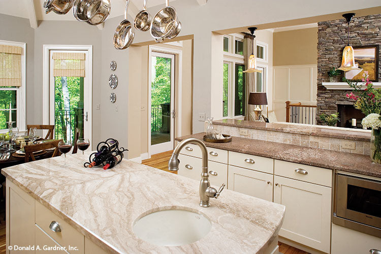 Island with a sink in the kitchen. The Laurelwood plan 5024.