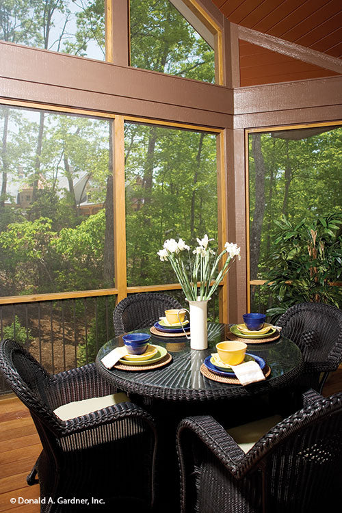 Seating in the screened in porch. The Laurelwood plan 5024.