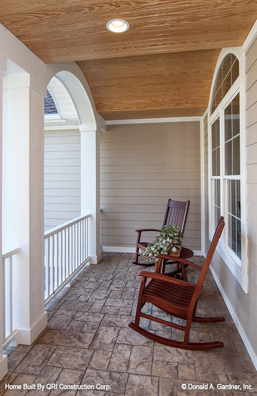 Wood ceiling and recessed lighting on the front porch. The Lennon plan 1300