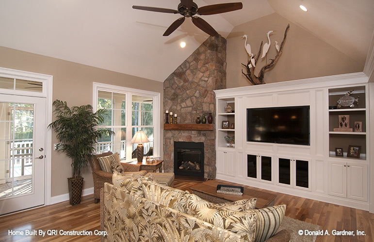 Vaulted ceiling and stone fireplace in the great room. The Lennon plan 1300