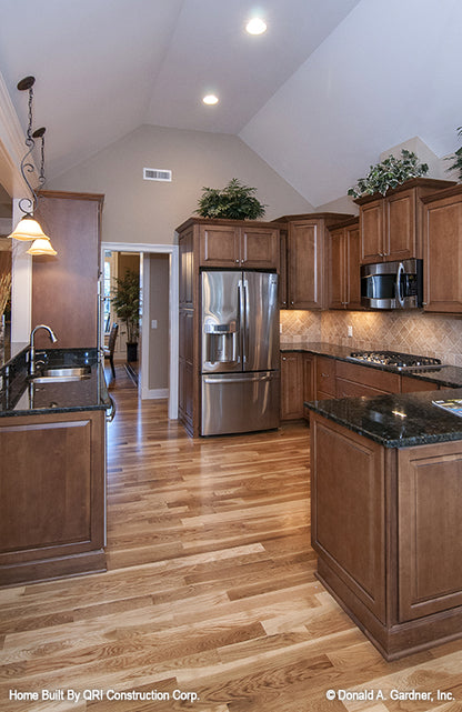 Vaulted ceiling and recessed lighting in the kitchen. The Lennon plan 1300