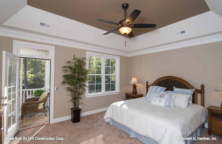 Tray ceiling in the master bedroom with patio door access. The Lennon plan 1300