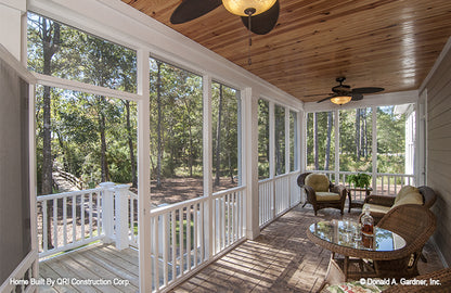 Screened in porch door access to steps leading to the yard. The Lennon plan 1300